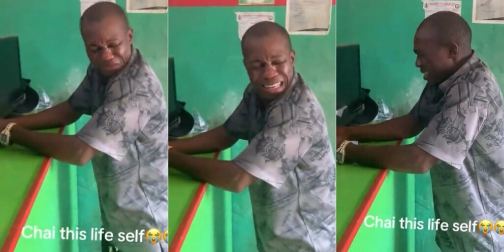 Man crying inside a betting shop after losing money on a football bet