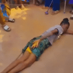Elderly women publicly flogging a young lady in a Nigerian community