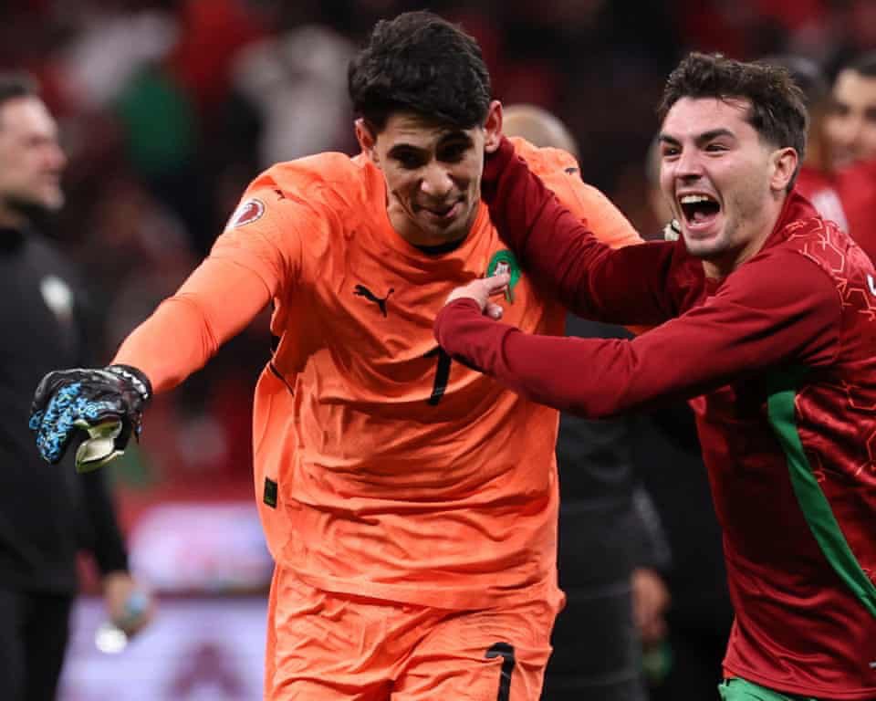Yassine Bounou celebrates after saving penalties against Nigeria at AFCON 2025